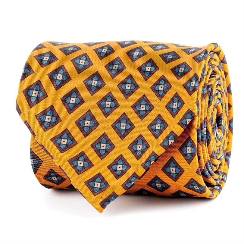 Cravatta in twill di seta arancione con stampa geometrica